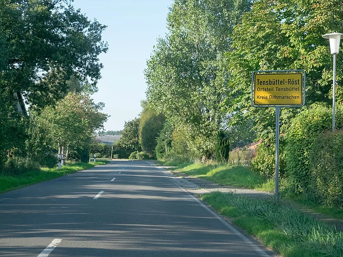 Ortsschild Tensbüttel-Röst Ortsschild Tensbüttel-Röst